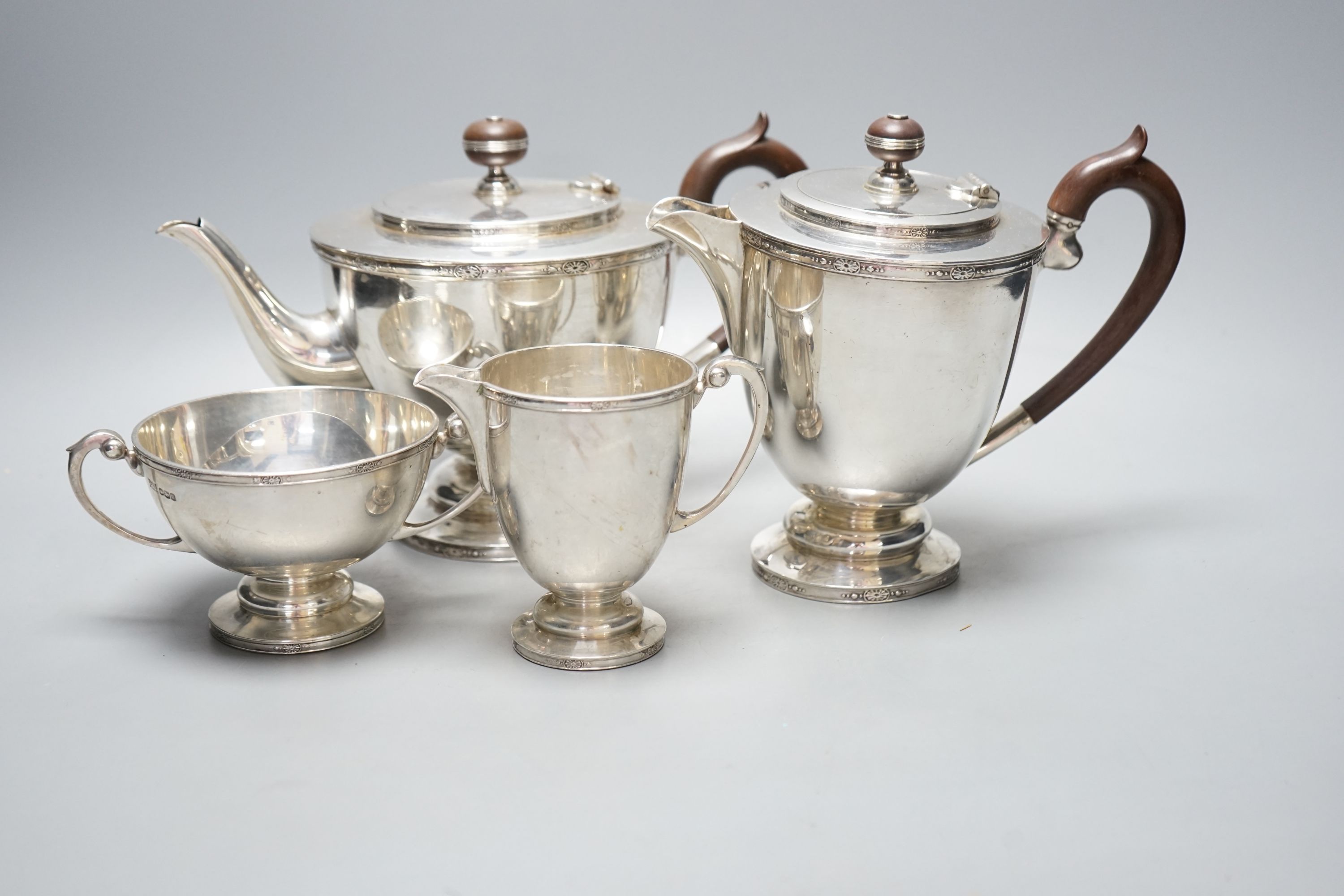 A George V silver four piece pedestal tea set, Brook & Son, Sheffield, 1926/7